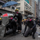 Protesters wearing 3M respirators clash with police after a rally in Kwun Tong on Aug. 24.